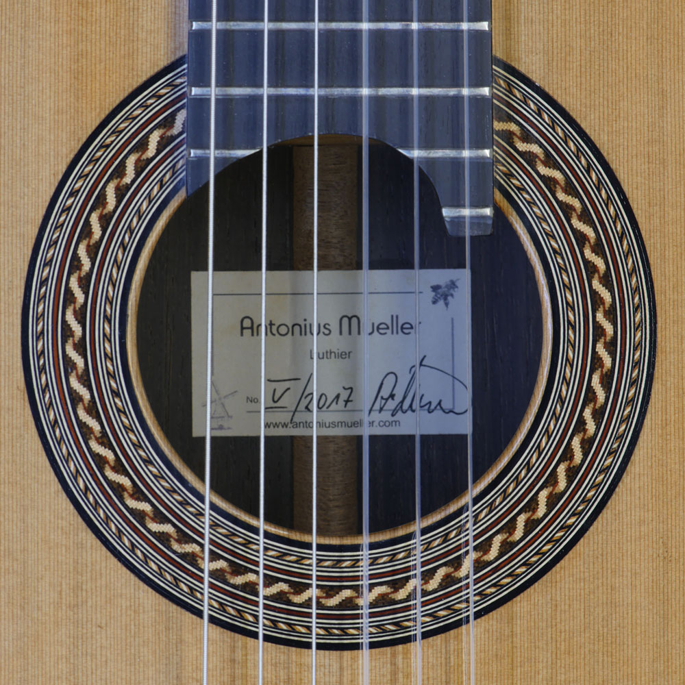 Rosette and label of the double top guitar built by the German guitar maker Antonius Müller mwith cedar top and Brazilian rosewood back and sides, scale 65 cm
